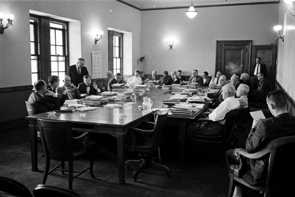 Members of the Wisconsin Legislature's Joint Committee on Finance work on the budgets of the University of Wisconsin and the State Colleges.