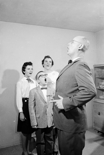 Doc Miller singing with his family.