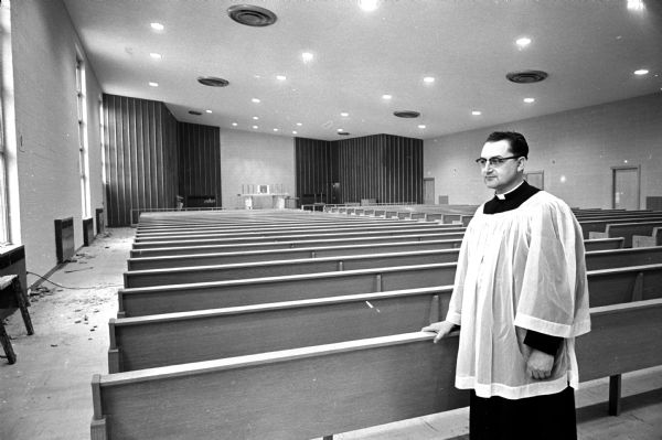 Reverend Wilfred J. Schuster looks over the interior of the new chapel sanctuary at the St. Maria Goretti Parish Center at Gilbert Road and Flad Avenue on Madison's southwest side.