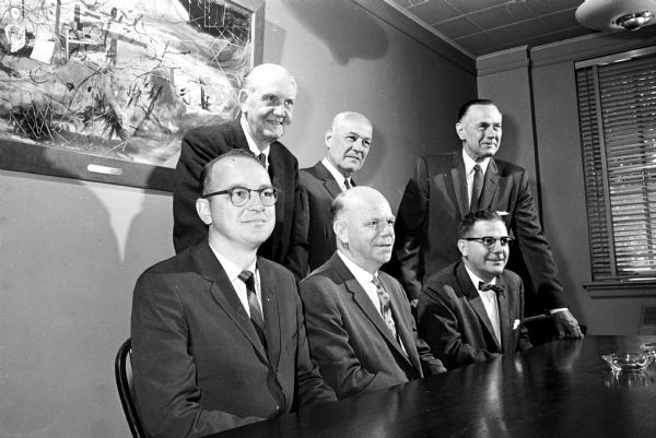 New officers of the Board of Directors of the Wisconsin Alumni Association are seated, left to right, Dr. Norman Becker, Fond du Lac, president; Lloyd Larson, sports editor of the Milwaukee Sentinel, first vice-president; and Charles O. Newlin, vice-president of the Continental Illinois Bank and Trust Company, Chicago, second vice-president.
Standing are John Berge, Madison, executive secretary of the association; Russell A. Teckemeyer, manager of Thompson and McKinnon, Madison, treasurer; and Don Anderson, publisher of The Wisconsin State Journal, chairman of the board.