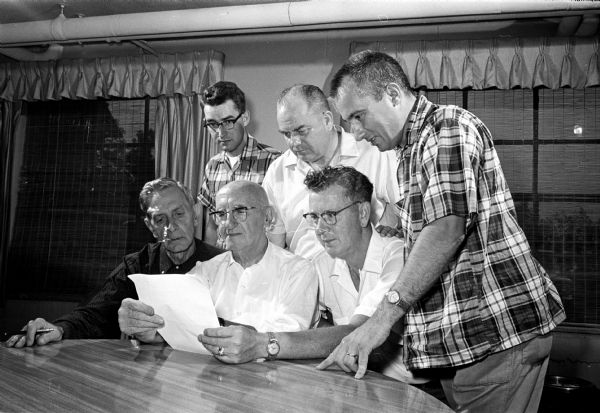 Shriners from the Knights of Columbus plan the 18th annual Shrine-Knights benefit for crippled and underprivileged children. Seated, left tor right: Walt Hendrickson, 1429 East Johnson Street;, Bert Salisbury, 420 Virginia Terrace; and Lyle Andrews, 1314 East Washington Avenue, co-chairman. Knights, standing from left: Bernard Stein, Verona, co-chairman; Joe Tisserand, 835 Prospect Place; and Bob Aulik, 114 South Owen Drive.