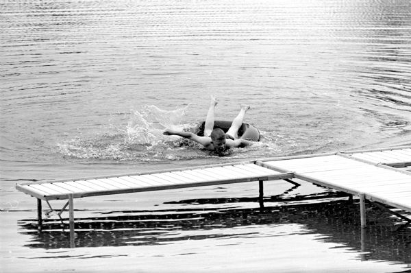 Mark Herrling swimming in the spring-fed pool on the Stanley Herrling farm. This is one of a series of photographs of a rural Cross Plains farm which was purchased 6 years ago by Stanley Herrling and returned to family ownership after a period of 40 years. The Herrling family has worked to build a comfortable home and restore the farm's soil, forest, and wildlife.