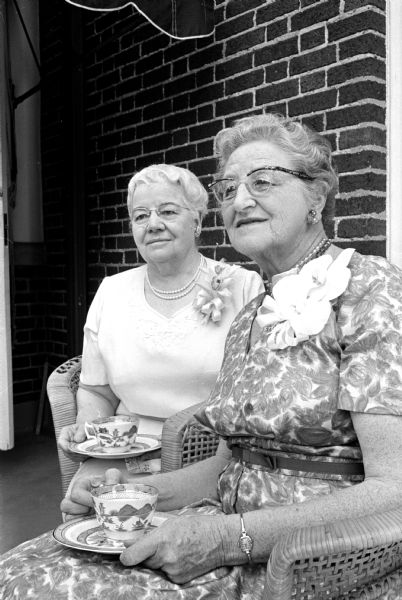 Miss Frances Zuill (left), retiring dean of the University of Wisconsin School of Home Economics, and Dr. May Reynolds, retiring home economic professor, are guests of honor at a farewell tea given by the University of Wisconsin Home Economics Alumnae Association. The event was held at the home of Mrs. Conrad A. Elvehjem, 130 North Prospect Avenue.