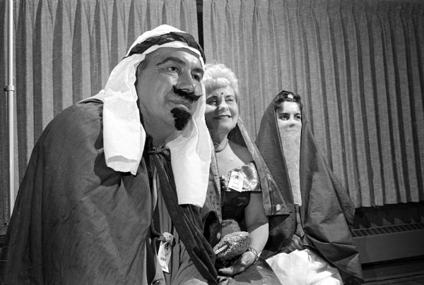 Wearing costumes to represent the song "The Sheik of Araby" are, left to right: Philip Wipperman, Mrs. John Larsen (Cross Plains), and Jeanne Wipperman.