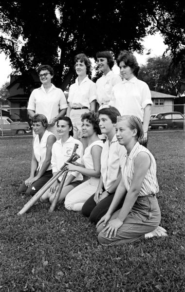 Group portrait of the Centralites of the city Softball League. They were the League champions in 1961. Team members, left to right are: front row - Nancy Miller, Leonare Swenson, Jan Evert, Marcia Felland and Sharon Bambrough; back row - Norene Smith, Sandi Quick, Molly DiMartino, and Marlene Felland.