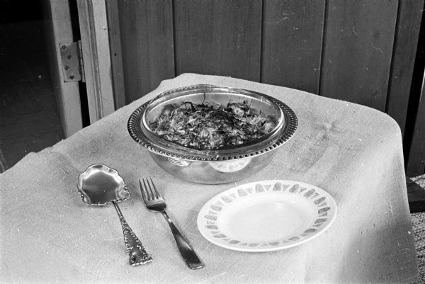 The recipe for Savory Cabbage submitted by Mrs. Elmer Elsing, Prairie du Sac, Wisconsin, was the second place winner in the vegetable category of the Wisconsin State Journal Cookbook Contest.
