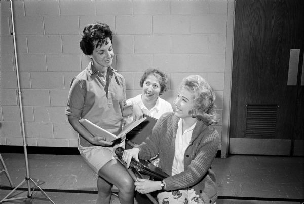 Phyllis Kaufman (left), Ruth Levey (center), and Mrs. Michael Sherman are shown rehearsing for a play to be presented at the Beth Israel sisterhood membership tea.
