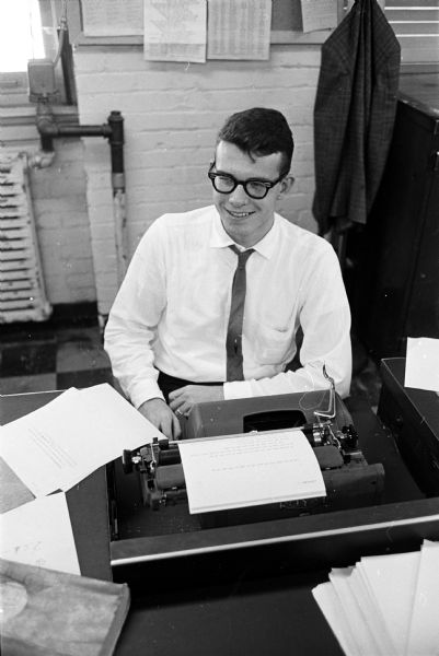 Alan Cleveland, University of Wisconsin journalism student, sitting in front of a typewriter during his last day as an interning newspaper reporter for the summer months. He is the first to serve as a Matson Newsman, which was established with memorial funds for Roy L. Matson, the previous editor of Wisconsin State Journal who died December 3, 1950.