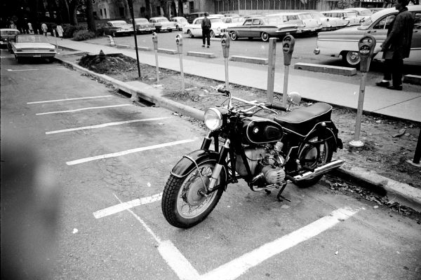 One motor scooter parked in a metered parking stall on Langdon street between the Memorial Union and the armory. The specially sized stalls were marked as an experiment.
