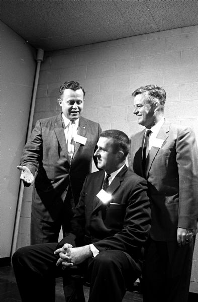 Left to right: A.A. MacArthur, Jerry Hill, and J.E. Maloney are shown chatting before the program begins at the annual Spahnferckel, sponsored by the Madison Mechanical Contractors Association. The purpose of this event is to provide connection and to discuss mutual problems between various segments of the construction business.