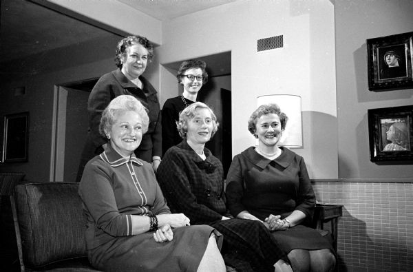 Planning committee meets to make arrangements for a series of group meetings for women members of the First Congregational Church, at the corner of University Ave. and Breese Terrace, in connection with the church's expansion fund drive. Shown seated (L-R) are Mrs. Perry W. Wilson, 3830 Cherokee Dr., general chairman; Mrs. Richard M. Laird, 637 Odell St.; and Mrs. Roland Day, 4806 Sherwood Rd.; and standing (L-R) Mrs. Conrad A. Elvehjem, 130 N. Prospect Ave.; and Mrs. Norris L. Tibbetts, 13 Veblen Place.