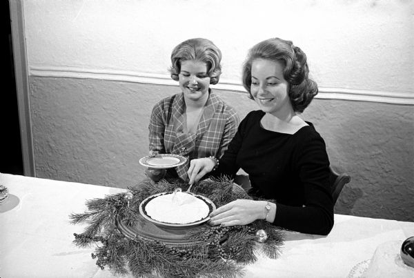 Bette Gebhardt, Milwaukee, left, and Gretchen Brown, Kankakee, Illinois are serving Grasshopper Pie, one of the desserts offered at Ann Emery Hall's "Tasting Tea" at 265 Langdon Street.