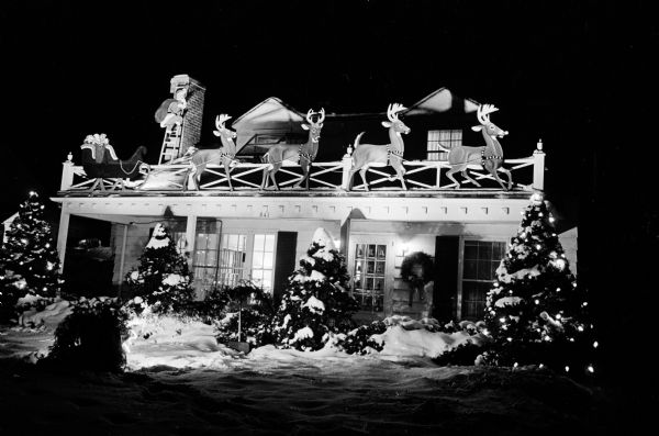 Exterior view of the house of Jack Savidusky, 341 Kensington Drive, decorated for the Christmas holiday with lights and reindeer figures.