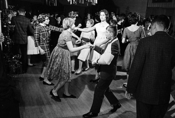 Dancing the rock 'n roll at the annual Shorewood Hills teenage holiday dancing party are Richard Harrison and Margaret Thompson (foreground). In the background are Thomas Beale, Joan Bridgman, and Barbara Siebecker.