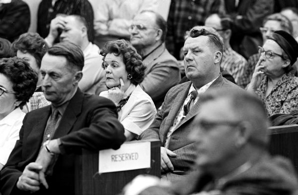 The original photo caption reads: "Mr. and Mrs. William Welter Sr. watch intently as their son takes the stand." Their son, William Jr., along with Lawrence Nutley and Richard Nickl, all of the Chicago area, were accused of slaying Patrolman James Lantz, Baraboo, and wounding Lake Delton Police Chief Eaugene Lee Kohl in an early morning gun battle in front of the Lake Delton village hall.