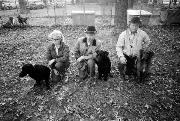 Members of the Madison Retrievers Club are successful in state and national competitions. Shown (L-R) are: Mary Howley with her black labrador, Matches of Candlewood; Dale Tietz with his black labrador, Sebastian St. George; and William Connor, with his golden retriever, Ripp'n Ready.