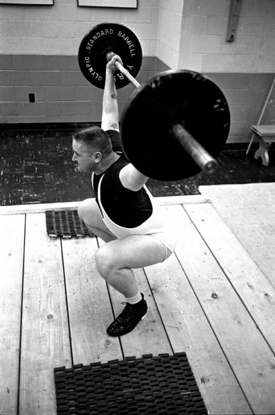 Norman Rauch, the Truax Field strongman who already holds three state records, working out in preparation for the Wisconsin Amateur Athletic Union senior weightlifting meet at the Madison YMCA.