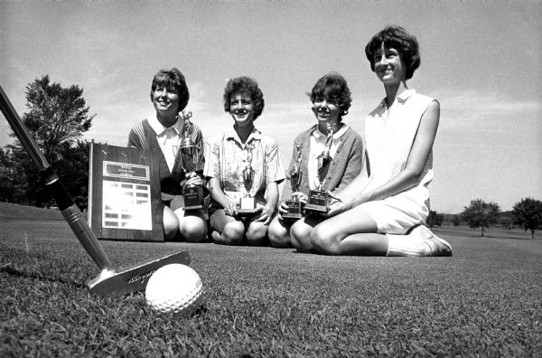 Winners posing at the Madison Junior girls golf tournament held at the Nakoma Blackhawk Country Club. Shown (left to right) are the winners of the various flights. Jackie Molinaro, championship flight; Geri Caravello, first flight; Barbara Smith, second flight; and Cathy Evans, third flight.
