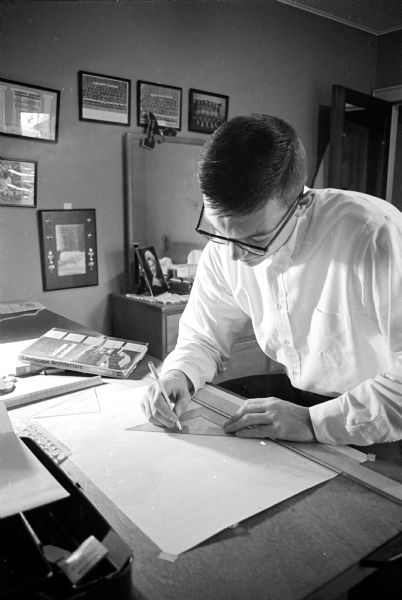 U.W. athlete Pat Richter is shown seated at his home doing late night studying of landscape architecture during the football season.
