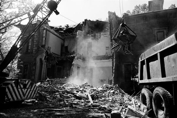 The 104-year old Vilas Mansion at 12 Gilman Street is demolished to make way for the new National Guardian Life Insurance Co. building. The house was built in 1859 by English lawyer Julius Clark and later purchased by U.S. Senator William Freeman Vilas in 1877.