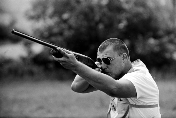 Bill Brauer 111, Fond du Lac, shooting his rifle during the State Trapshooting Tournament. He won the All-Around championship with a 382x400 score.