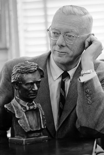 Artist and sculptor Chester Mayer shown with a bust of President Lincoln, which had been created by Chester's uncle, Louis Mayer. Chester is working on a likeness of John F. Kennedy as a companion piece for the Lincoln bust.