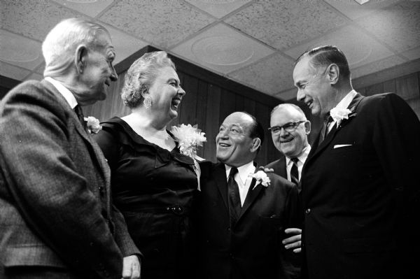 Wrestling and charity promoter Jimmy Demetral, center, was honored at a testimonial dinner with proceeds going to the Greek Community, which he helped found. Pictured with Jimmy are, left to right, William T. Evjue, editor and publisher of the Capital Times newspaper; Louise Marston, Wisconsin State Journal society editor; Ted Meloy, Bank of Madison president; and Don Anderson, Wisconsin State Journal publisher.
