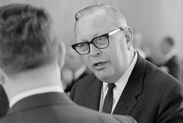 A Scandinavian trade delegation of 25 Norwegian businessmen and journalists visits Madison to publicize the inaugural flight of Scandinavian Airlines System (SAS) direct service from Copenhagen to Chicago. Hans Engen, Norwegian embassador to the U.S.A., is shown being interviewed.