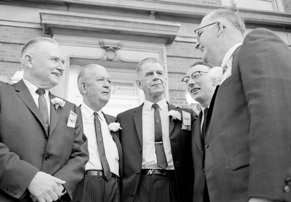 Four businessmen at the Management Night Banquet visiting with the speaker, W. Grady Clark, second from left. They are, left to right, James Cotter, vice-president of the Ohio Chemical and Surgical Equipment Co.; Clark, chairman of the board of investors of Diversified Services, Minneapolis; Glenn Novotny, director of productions for Ray-O-Vac; Joseph Wilson, vice-president of the North Central division of Frito-Lay; and Dorsey Botham, president of the Wisconsin Foundry and Machine Co.