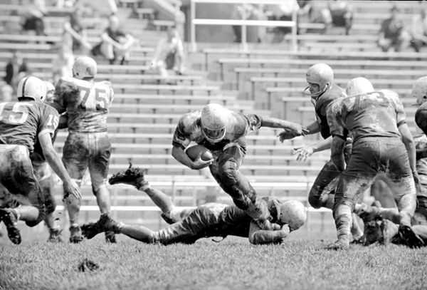 U.W. halfback Carl Silverti is shown being tripped up in Wisconsin's spring football game at Camp Randall. Silvestri was the game's leading rusher.