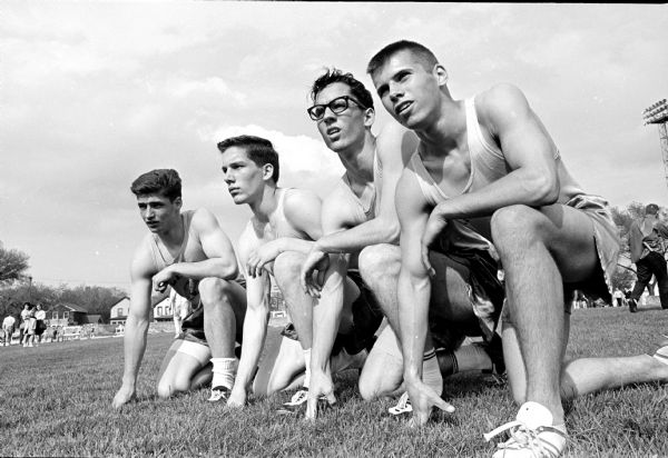 Madison East High School sprint medley relay team sets a new record at the annual Madison city track meet. Left to right are: Dick Best, Larry Tyler, Jim Langone, and Dave Monroe.