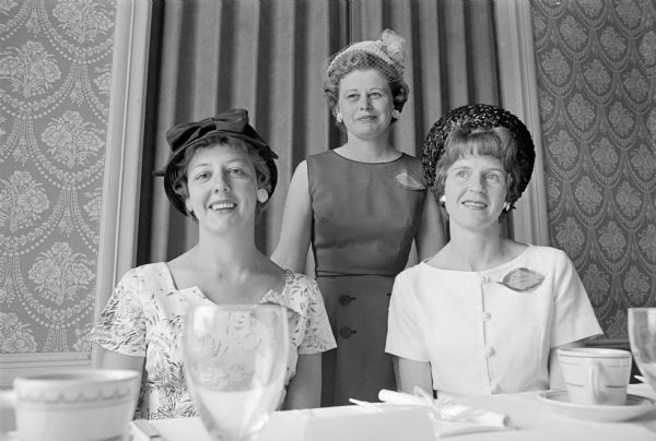 Who's New club wound up its season with a luncheon at Maple bluff Country Club. Pictured L to R: Marles Christoph; Virginia Schomberg; and Constance Lamp. Each woman is wearing a leaf-shaped name tag.