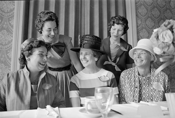 Among the guests at the Who's New club luncheon were L to R: Mrs. James Turner, Oregon; Mrs. John MacLean, Middleton; Barbara Bodart; Lynn Frommuer; and Clarice Yarger. Four of the women are wearing leaf-shaped name tags.