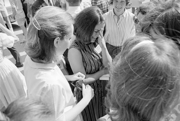Esen Ozgen, an American Field Service student from Turkey, cries while saying her goodbyes to her Madison friends before leaving to tour the eastern states and then returning to Turkey. While in Madison, she attended Monona Grove High and stayed with the Maurice Woodrow family.