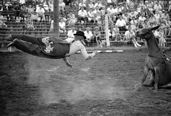 A clown attempts to move a stubborn mule at the 15th annual World's Championship Rodeo at the Holmes No-Oak ranch.