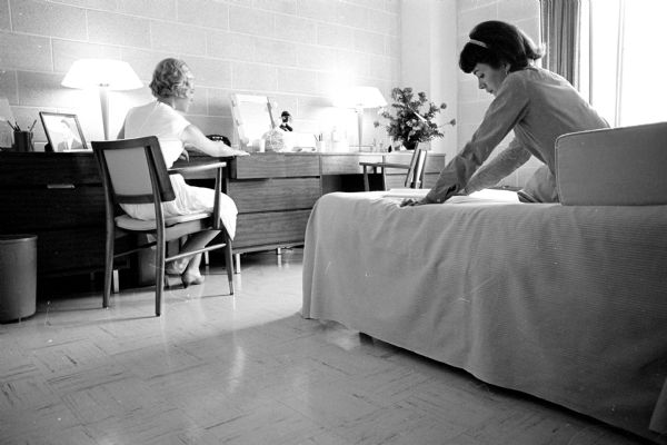 In one of a series of photographs showing the luxurious features of private dormitories on campus, two grad students, Shirley Olsen, left, Milwaukee, and Judy Bell, Wauwatosa, are shown in their room at Allen Hall, one of the newer private dormitories for women. It is located at 505 North Frances.