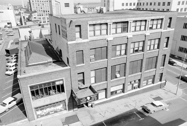 Aerial view of Madison Newspapers Inc. building, 115-123 S. Carroll Street. Included in the building was <i>The Capital Times</i> newspaper, the <i>Wisconsin State Journal</i> newspaper, Associated Press and United Press news organizations.
