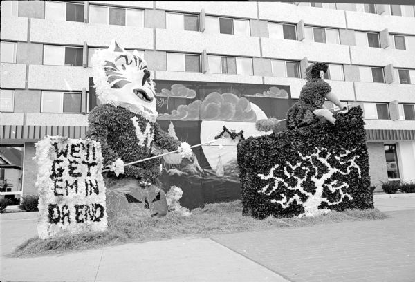 Whitbeck, Jackson, Frisby, Whales and Fletcher Houses in Sellery Hall built this Homecoming decoration which says: "We'll get them in the end."