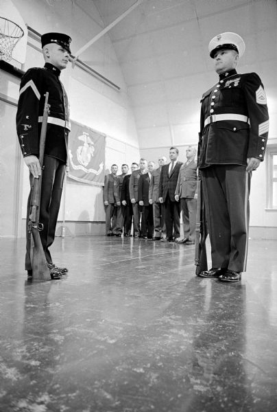 Representatives of the many facets of the Marine Corps prepare for celebrating Marine Corps Week in Madison. In front are Marlin Kelly and Ralph J. Foote.