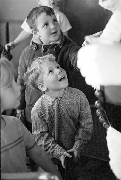 The Santa Express Train took 6,000 children from Madison to Stoughton and back.  Shown greeting Santa is Scott Cameron (with freckles) in center, with other friends.