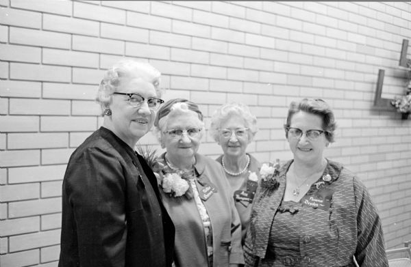 Four employees of Madison General Hospital who received 30-year pins at a dinner honoring employees with at least ten years of service. Left to right are: Hulda Tenjum, Nellie Brown, Ann Thompson, and Florence Dryden.