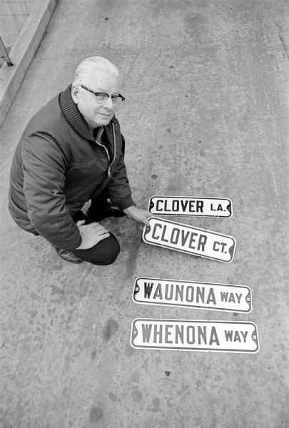 Harold Thompson, City Traffic Engineering Foreman, with a display of some street signs with look-alike and sound-alike names, a problem for fire and police emergency response.