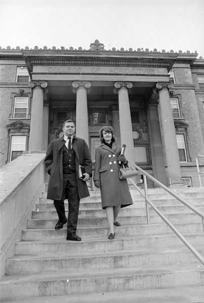 Gregory and Patty Herrling are shown coming down the steps of the U.W. Agriculture building on the day of their mid-year graduation.