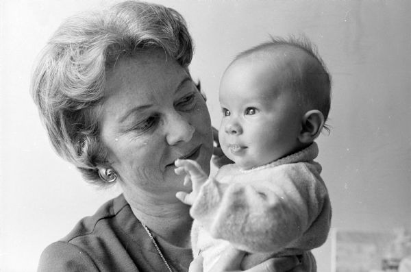 Grandmother Florence Herrling is shown holding her grandson, Jimmy. She has been a regular babysitter for him since his birth on Oct. 18 while her son and daughter-in-law were working on their degrees at the U.W.  Both have now graduated mid-term.