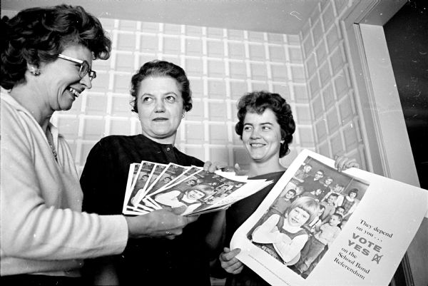 Members of Madison's Parent-Teacher Associations are attempting to win favor for the $6,450,000 school bond referendum by distributing booklets citing facts about the city's school needs.  Ruth Czerepinski, left, is co-chairman, Winifred Eide, center, is a block worker and Marilyn Niebuhr Jr., right, is president of the Lowell School PTA.