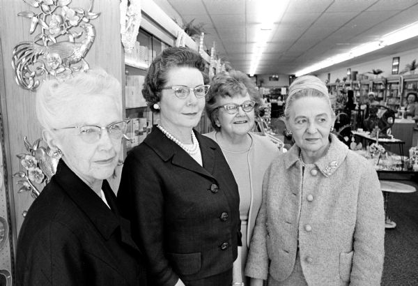 Members of Madison Zonta Club preparing to observe the organization's 25th anniversary. Left to right:  Lillian Fried, Lulu Korn, Winifred Layden, and Erdis Hansen. Miss Korn is the current president of the club and the other three are among the charter members.