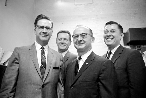 The original caption states, "New officers of the Madison chapter of the Chartered Life Underwriters were recently elected. Left to right are: Dean Colden, Equitable Life Assurance Society of the United States, president; James Vincent Sr., Lincoln National Life Insurance Co., vice-president; William Weger, National Mutual Benefit Assn., secretary-treasure; and Atty. Aubrey Fowler, education chairman. All except Fowler are CLUs."