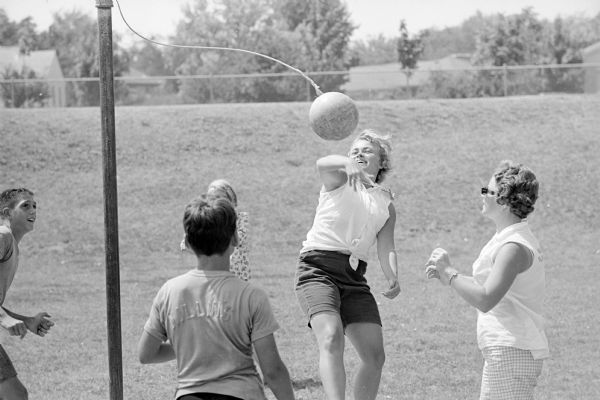 Kathy Kurtz, a playground leader at Cherokee Heights playground, playing tether ball with youngsters at her playground.