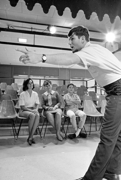 The Jerry (Deane-TV name) Druckenbrod family performing together in the Theater-Go-Round production of "Babes in Arms." Dave Bruckenbrod is shown during rehearsal for the play. Seated left to right are Dave's siblings Kathy, Sara, and Bob.