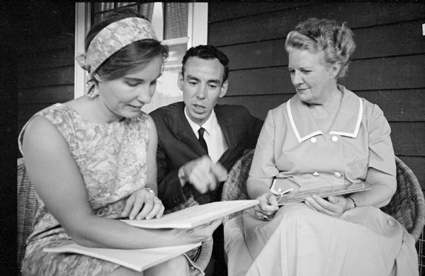 Lloyd Besant, author of a "Happening" and president of the Village Playhouse that will produce it, is shown discussing his script with Donna Zegarowicz (left), who will direct, and Julia Hanks Mailer, member of the troupe's board.